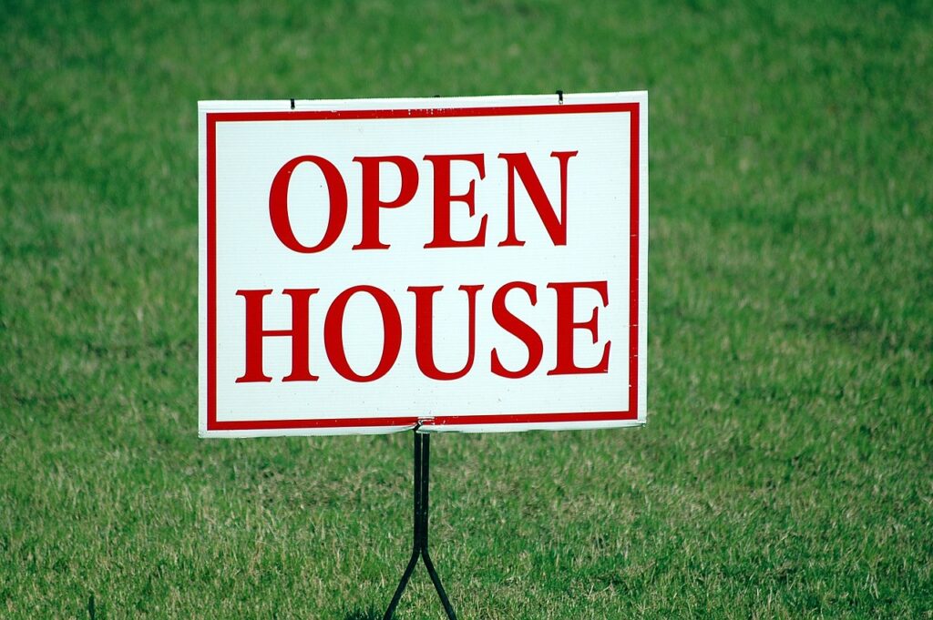  An open house sign in front of a property