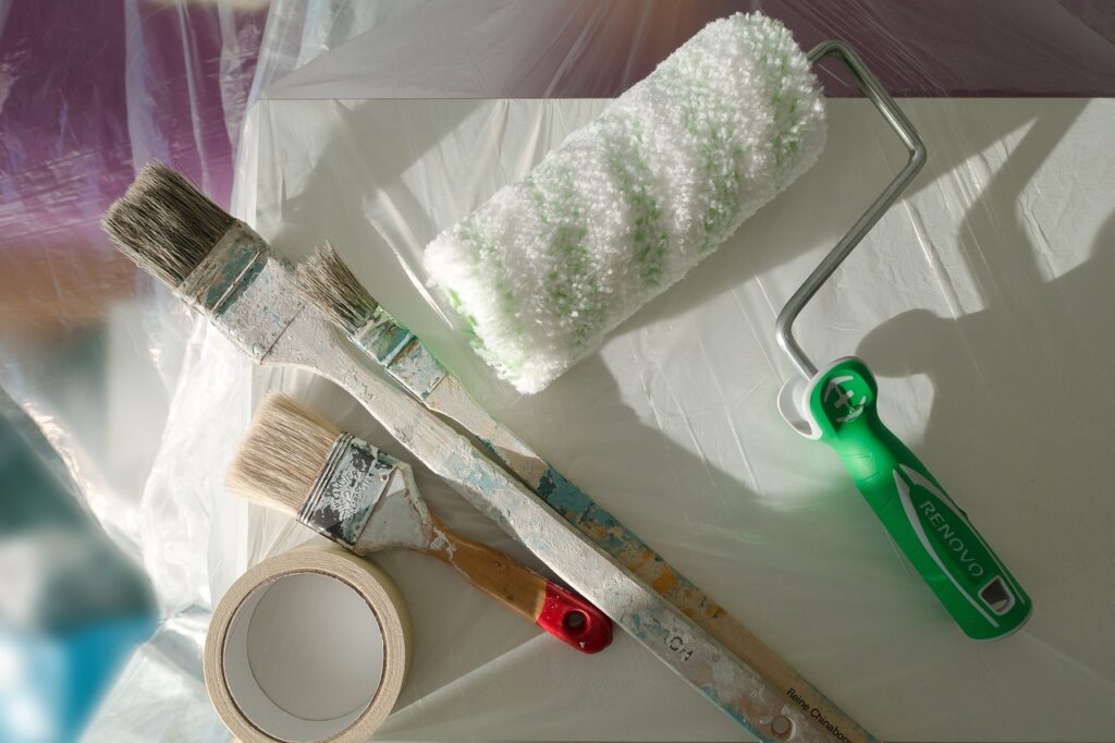 Basic DIY tools like brushes and paint rollers.