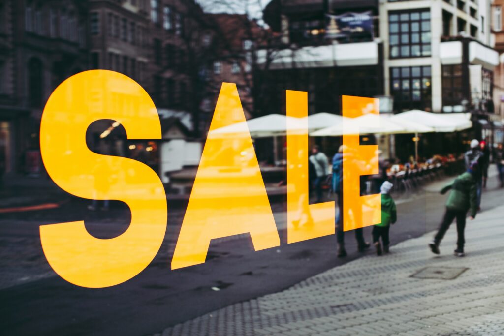 “Sale” sign on a store’s window.