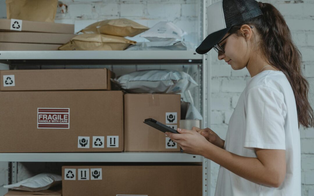 Woman in white shirt looking at a smartphone